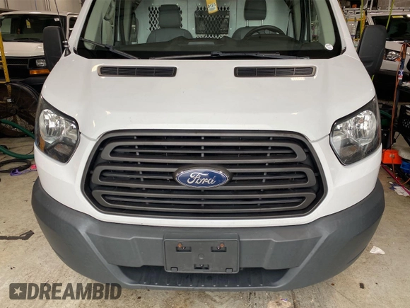 2016 Ford Transit Cargo z VIN 1FTYE1YM3GKB18575, wystawiony jako IAAI lot #42734024 z przebiegiem 186 138 mil mil oraz . Historia ofert i sprzedaży dostępna na DreamBid. Obrazek 7.