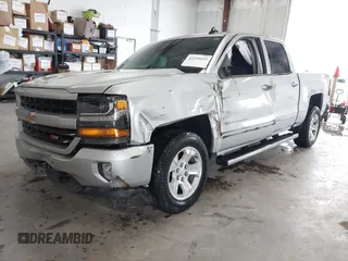 2017 Chevrolet Silverado 1500 LT with VIN 3GCUKREC2HG473554, listed as a IAAI auction lot 42220143 with 80,000 mi miles and . Bid and sale history available at DreamBid. Image 2.