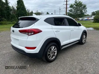 2018 Hyundai Tucson SEL z VIN KM8J33A40JU676727, wystawiony jako Copart lot #87532055 z przebiegiem 128 554 mil mil oraz Czysty tytuł • Clean title. Historia ofert i sprzedaży dostępna na DreamBid. Obrazek 4.