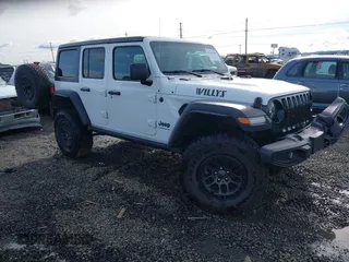 2023 Jeep Wrangler Sport with VIN 1C4HJXDG4PW567027, listed as a IAAI auction lot 41633197 with 14,782 mi miles and . Bid and sale history available at DreamBid. Image 1.