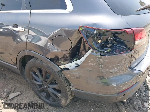 2015 Mazda CX-9 Grand Touring with VIN JM3TB3DA0F0459024, listed as a IAAI auction lot 42452288 with 174,716 mi miles and . Bid and sale history available at DreamBid. Image 6.