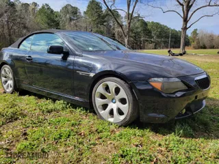 2005 BMW 6 Series 645Ci with VIN WBAEK73445B261180, listed as a IAAI auction lot 41768424 with 128,824 mi miles. Bid and sale history available at carsss.com. Image 1.