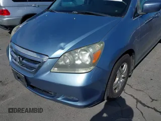 2006 Honda Odyssey EX-L z VIN 5FNRL38706B075356, wystawiony jako IAAI lot #42021960 z przebiegiem 120 455 mil mil oraz . Historia ofert i sprzedaży dostępna na DreamBid. Obrazek 17.