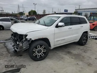 2015 Jeep Grand Cherokee Overland с VIN 1C4RJECG7FC872175, выставлен на аукционе Copart как лот 50653205 с пробегом 117 433 миль миль и Списание • Salvage title. История ставок и продаж доступна на DreamBid. Изображение 1.