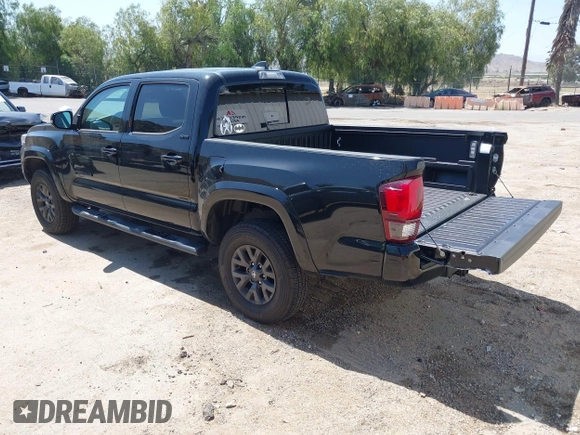 2023 Toyota Tacoma SR with VIN 3TMCZ5AN1PM654572, listed as a IAAI auction lot 42312575 with 14,111 mi miles and . Bid and sale history available at DreamBid. Image 3.