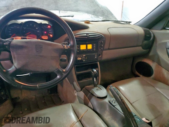 1999 Porsche Boxster z VIN WP0CA2988XU623383, wystawiony jako Copart lot #60567895 z przebiegiem Nie podano mil oraz Czysty tytuł • Clean title. Historia ofert i sprzedaży dostępna na DreamBid. Obrazek 8.