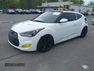 2012 Hyundai Veloster w/Gray Int with VIN KMHTC6AD6CU021176, listed as a IAAI auction lot 42205695 with 93,665 mi miles and . Bid and sale history available at DreamBid. Image 2.