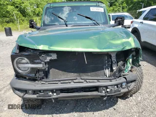 2023 Ford Bronco z VIN 1FMEE5DP7PLB60568, wystawiony jako Copart lot #62118915 z przebiegiem 25 681 mil mil oraz Nie do naprawy • Non repairable. Historia ofert i sprzedaży dostępna na DreamBid. Obrazek 5.