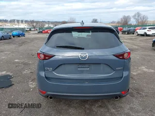 2021 Mazda CX-5 Touring with VIN JM3KFBCM5M0483547, listed as a IAAI auction lot 41683694 with 55,791 mi miles. Bid and sale history available at carsss.com. Image 16.