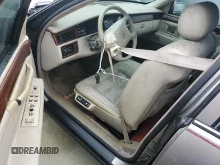 1995 Cadillac Concours z VIN 1G6KF52Y6SU244970, wystawiony jako Copart lot #75079524 z przebiegiem Nie podano mil oraz Szkody całkowita. Historia ofert i sprzedaży dostępna na DreamBid. Obrazek 8.
