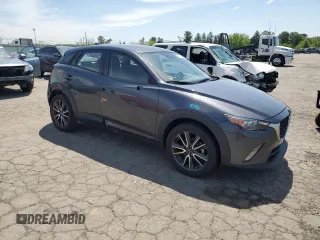 2017 Mazda CX-3 Touring z VIN JM1DKFC76H0149368, wystawiony jako Copart lot #55747305 z przebiegiem 47 946 mil mil oraz Szkoda całkowita • Salvage title. Historia ofert i sprzedaży dostępna na DreamBid. Obrazek 4.