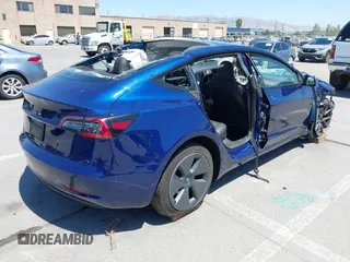2023 Tesla Model 3 z VIN 5YJ3E1EA2PF506429, wystawiony jako IAAI lot #42320628 z przebiegiem Nie podano mil oraz . Historia ofert i sprzedaży dostępna na DreamBid. Obrazek 4.