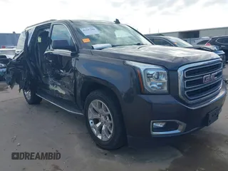 2016 GMC Yukon SLT with VIN 1GKS2BKC1GR406739, listed as a IAAI auction lot 41247286 with 106,023 mi miles. Bid and sale history available at carsss.com. Image 1.