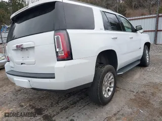 2019 GMC Yukon SLT with VIN 1GKS2BKC6KR183607, listed as a IAAI auction lot 41557880 with 120,971 mi miles. Bid and sale history available at carsss.com. Image 4.