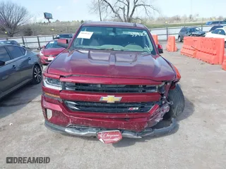 2016 Chevrolet Silverado 1500 LT with VIN 3GCUKREC0GG354271, listed as a IAAI auction lot 38948207 with 130,369 mi miles. Bid and sale history available at carsss.com. Image 12.