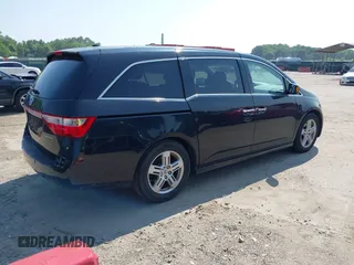 2011 Honda Odyssey Touring with VIN 5FNRL5H97BB073708, listed as a IAAI auction lot 42409164 with 141,986 mi miles and . Bid and sale history available at DreamBid. Image 4.