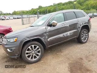 2017 Jeep Grand Cherokee Overland with VIN 1C4RJFCG6HC964435, listed as a IAAI auction lot 42407567 with 113,760 mi miles and . Bid and sale history available at DreamBid. Image 2.