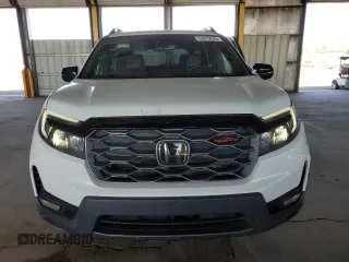 2023 Honda Passport TrailSport z VIN 5FNYF8H68PB000476, wystawiony jako Copart lot #55079045 z przebiegiem 30 543 mil mil oraz Szkody całkowita. Historia ofert i sprzedaży dostępna na DreamBid. Obrazek 5.