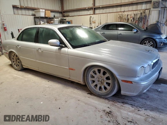 2004 Jaguar XJ with VIN SAJEA71C84SG07220, listed as a Copart auction lot 70916164 with 151,102 mi miles and Salvage Title. Bid and sale history available at carsss.com. Image 4.