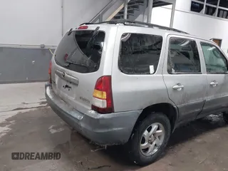 2003 Mazda Tribute DX with VIN 4F2YZ02B73KM43813, listed as a IAAI auction lot 41575708 with 202,214 mi miles and . Bid and sale history available at carsss.com. Image 4.