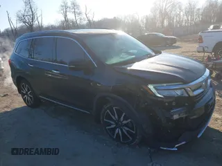 2019 Honda Pilot Touring 7-Passenger with VIN 5FNYF6H65KB061796, listed as a IAAI auction lot 41650857 with 122,417 mi miles. Bid and sale history available at carsss.com. Image 1.
