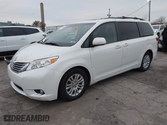 2015 Toyota Sienna XLE with VIN 5TDYK3DC9FS595827, listed as a IAAI auction lot 41014820 with 119,143 mi miles. Bid and sale history available at carsss.com. Image 2.