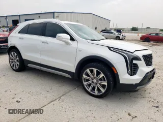 2023 Cadillac XT4 FWD Premium Luxury with VIN 1GYFZCR42PF110122, listed as a Copart auction lot 57332955 with 11,427 mi miles and Salvage title. Bid and sale history available at DreamBid. Image 4.