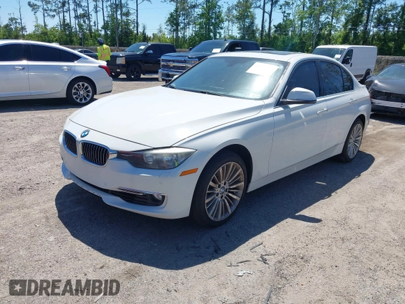 2013 BMW 3 Series 328i xDrive with VIN WBA3B5C51DJ599144, listed as a IAAI auction lot 42059260 with 84,153 mi miles. Bid and sale history available at carsss.com. Image 2.
