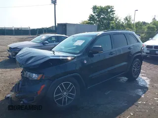 2018 Jeep Grand Cherokee Trailhawk with VIN 1C4RJFLG4JC241057, listed as a IAAI auction lot 42416590 with 81,822 mi miles and . Bid and sale history available at DreamBid. Image 2.