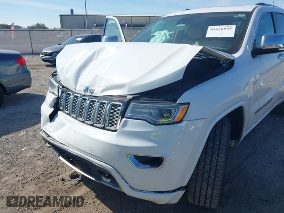 2017 Jeep Grand Cherokee Overland z VIN 1C4RJECG5HC959981, wystawiony jako IAAI lot #41638958 z przebiegiem 102 122 mil mil oraz . Historia ofert i sprzedaży dostępna na DreamBid. Obrazek 6.