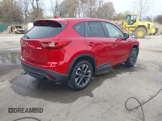 2016 Mazda CX-5 Grand Touring with VIN JM3KE4DY9G0865780, listed as a IAAI auction lot 41913914 with 76,579 mi miles. Bid and sale history available at carsss.com. Image 4.