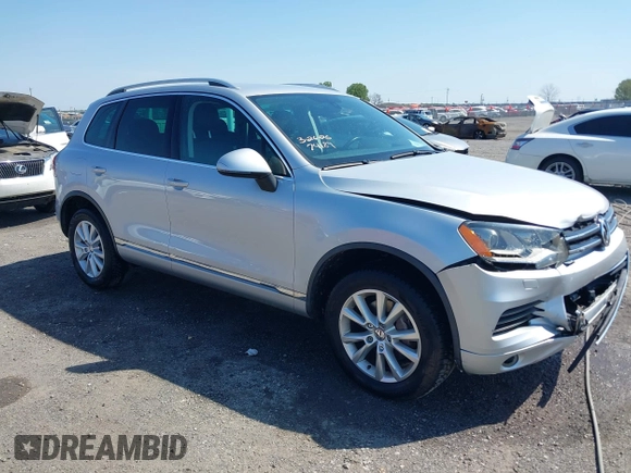 2014 Volkswagen Touareg Sport with VIN WVGEF9BP6ED007436, listed as a IAAI auction lot 41953307 with 114,925 mi miles and . Bid and sale history available at DreamBid. Image 1.