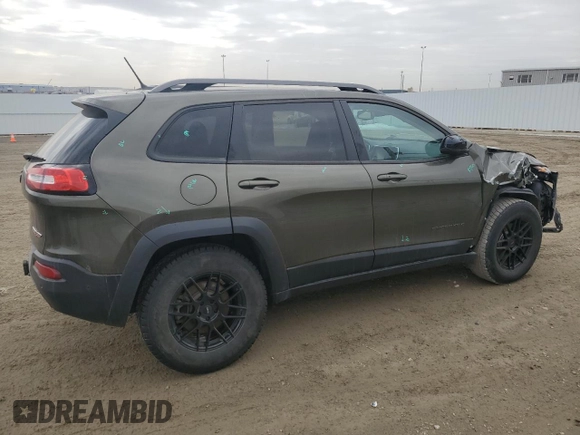 2015 Jeep Cherokee Trailhawk with VIN 1C4PJMBS0FW678738, listed as a Copart auction lot 50651235 with 147,793 mi miles and Salvage title. Bid and sale history available at DreamBid. Image 3.