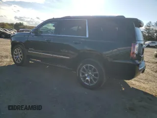 2016 GMC Yukon Denali with VIN 1GKS1CKJXGR329103, listed as a Copart auction lot 75492494 with 124,374 mi miles and Salvage Title. Bid and sale history available at carsss.com. Image 2.