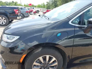 2023 Chrysler Pacifica Hybrid Touring L with VIN 2C4RC1L70PR622000, listed as a IAAI auction lot 42711826 with 65,109 mi miles and . Bid and sale history available at DreamBid. Image 6.