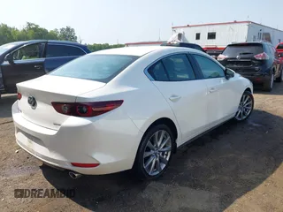 2022 Mazda 3 Carbon Edition with VIN 3MZBPACL0NM318573, listed as a IAAI auction lot 42403393 with 8,762 mi miles and . Bid and sale history available at DreamBid. Image 4.
