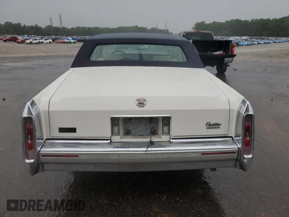 1992 Cadillac Brougham with VIN 1G6DW54E5NR708009, listed as a Copart auction lot 56849345 with 83,203 mi miles and Salvage title. Bid and sale history available at DreamBid. Image 6.