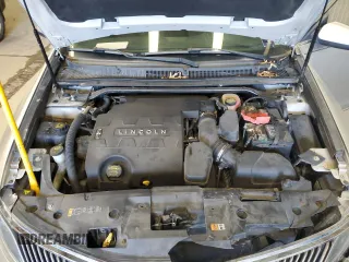 2013 Lincoln MKS z VIN 1LNHL9EK0DG605184, wystawiony jako Copart lot #51914305 z przebiegiem 173 117 mil mil oraz Szkoda całkowita • Salvage title. Historia ofert i sprzedaży dostępna na DreamBid. Obrazek 11.