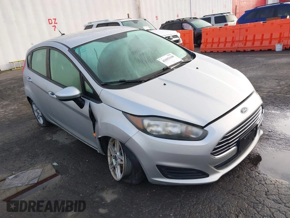 2019 Ford Fiesta SE z VIN 3FADP4EJ7KM147864, wystawiony jako IAAI lot #41692160 z przebiegiem 87 417 mil mil oraz . Historia ofert i sprzedaży dostępna na DreamBid. Obrazek 1.