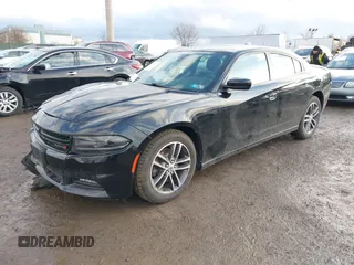 2019 Dodge Charger SXT with VIN 2C3CDXJG3KH630975, listed as a IAAI auction lot 41580174 with 74,575 mi miles and . Bid and sale history available at DreamBid. Image 2.