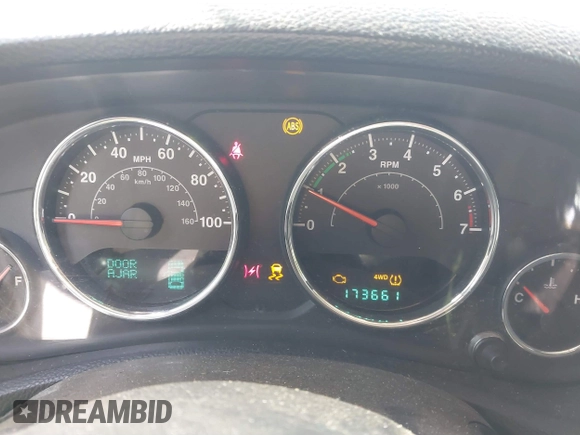 2012 Jeep Wrangler Unlimited Sport with VIN 1C4BJWDG2CL258264, listed as a IAAI auction lot 41880235 with 173,661 mi miles. Bid and sale history available at carsss.com. Image 7.