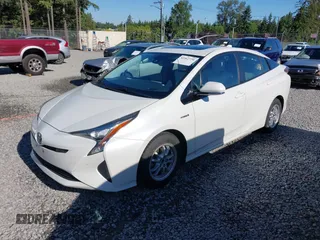 2017 Toyota Prius Two z VIN JTDKARFU1H3033538, wystawiony jako IAAI lot #42362770 z przebiegiem 74 671 mil mil oraz . Historia ofert i sprzedaży dostępna na DreamBid. Obrazek 2.