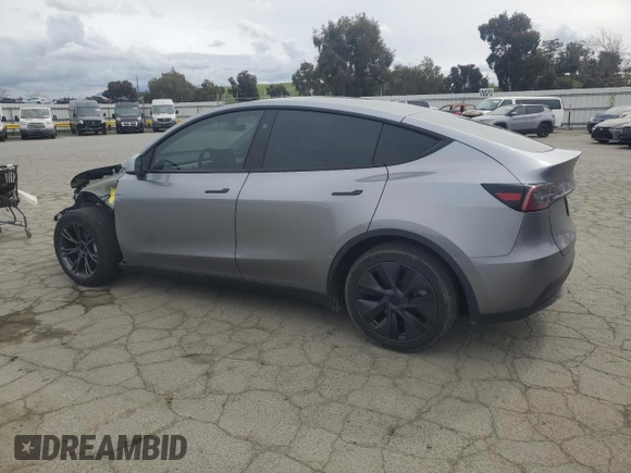 2025 Tesla Model Y Long Range with VIN 7SAYGDED7SF227582, listed as a Copart auction lot 47556595 with 5,340 mi miles and Salvage Title. Bid and sale history available at DreamBid. Image 2.
