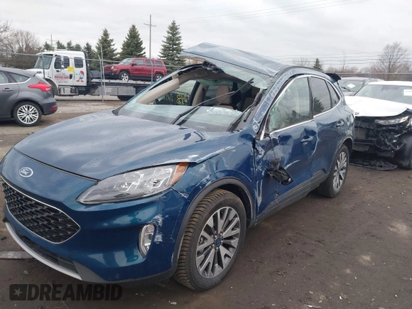 2020 Ford Escape Titanium with VIN 1FMCU9J98LUC00068, listed as a IAAI auction lot 41843755 with 42,525 mi miles and . Bid and sale history available at DreamBid. Image 6.