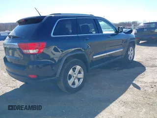 2011 Jeep Grand Cherokee Laredo with VIN 1J4RR4GG3BC670712, listed as a IAAI auction lot 41738127 with 93,714 mi miles and . Bid and sale history available at DreamBid. Image 4.