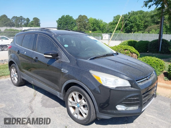 2013 Ford Escape SEL with VIN 1FMCU0HX8DUB38480, listed as a IAAI auction lot 42176271 with 154,309 mi miles. Bid and sale history available at carsss.com. Image 1.