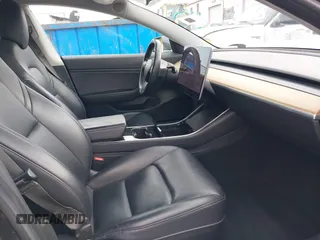 2018 Tesla Model 3 Long Range Battery with VIN 5YJ3E1EA8JF059385, listed as a IAAI auction lot 42116589 with 63,630 mi miles and . Bid and sale history available at DreamBid. Image 5.