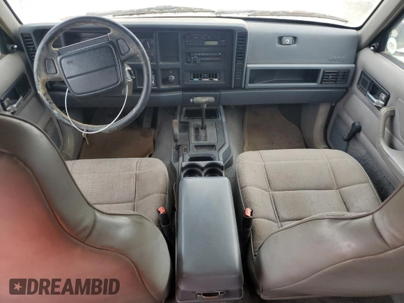 1996 Jeep Cherokee Sport z VIN 1J4FJ68S3TL103684, wystawiony jako Copart lot #63466265 z przebiegiem 163 715 mil mil oraz Czysty tytuł • Clean title. Historia ofert i sprzedaży dostępna na DreamBid. Obrazek 8.