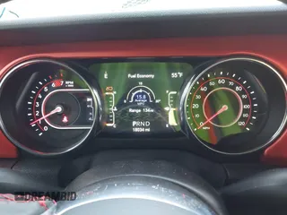 2021 Jeep Wrangler Unlimited Rubicon with VIN 1C4HJXFNXMW560512, listed as a IAAI auction lot 42124812 with 18,034 mi miles and . Bid and sale history available at DreamBid. Image 7.
