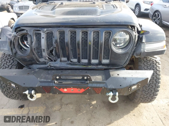 2020 Jeep Wrangler Unlimited Rubicon with VIN 1C4HJXFG1LW141335, listed as a IAAI auction lot 42724973 with 59,843 mi miles and . Bid and sale history available at DreamBid. Image 6.